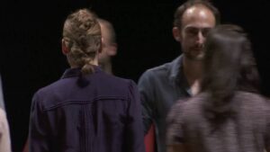 a performance of six acrobats on a spinning platform